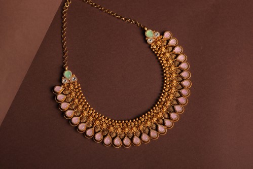 Konikkara antique gold teardrop necklace with pink stones